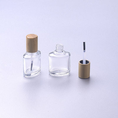 polnische Glasflasche 15ml des leeren Nagels mit hölzerner Bambuskappe der Bürste bilden