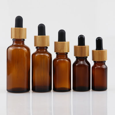 kosmetische Glasflasche des ätherischen Öls 100ml mit Bambustropfenzähler Sorgfalt-Haut Brown